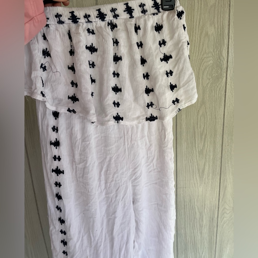 white sleeveless jumpsuit.